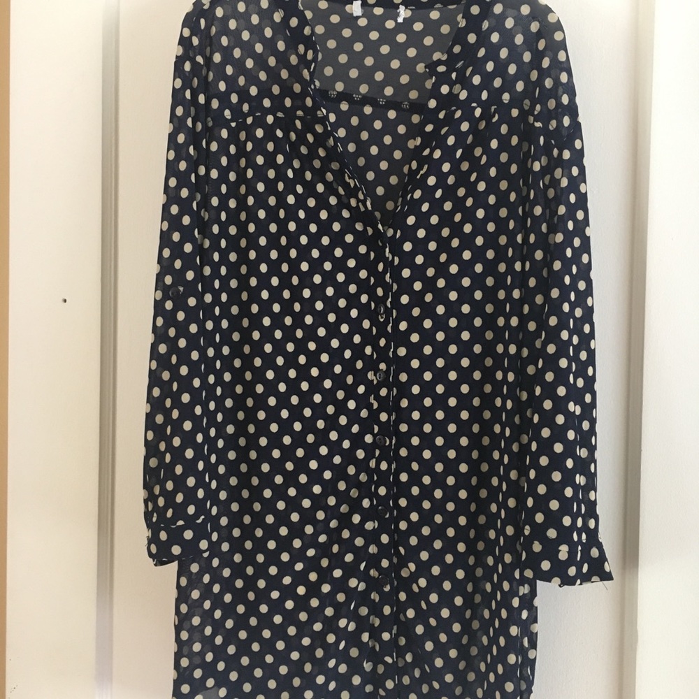 Navy blue polka dot blouse.